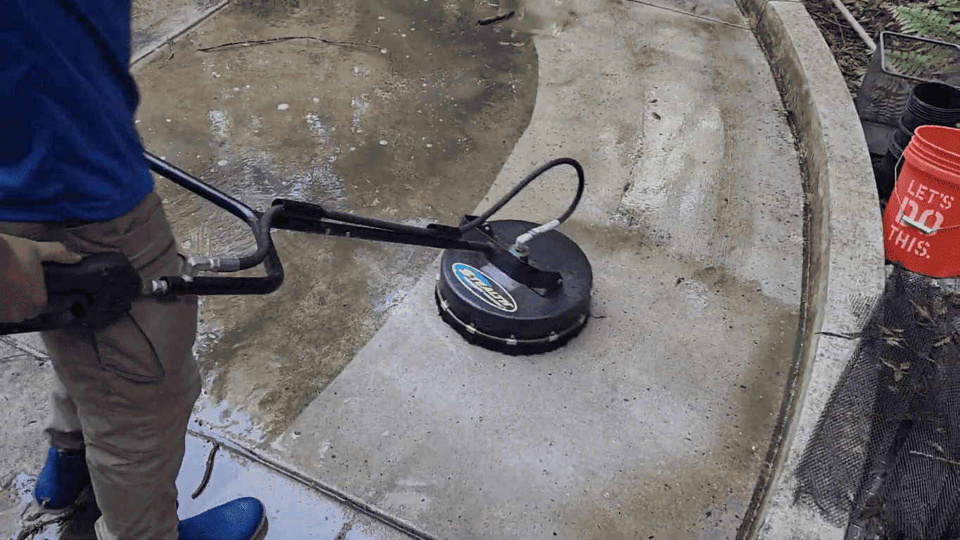 Oil-stained driveway in Hayward restored with professional pressure washing.