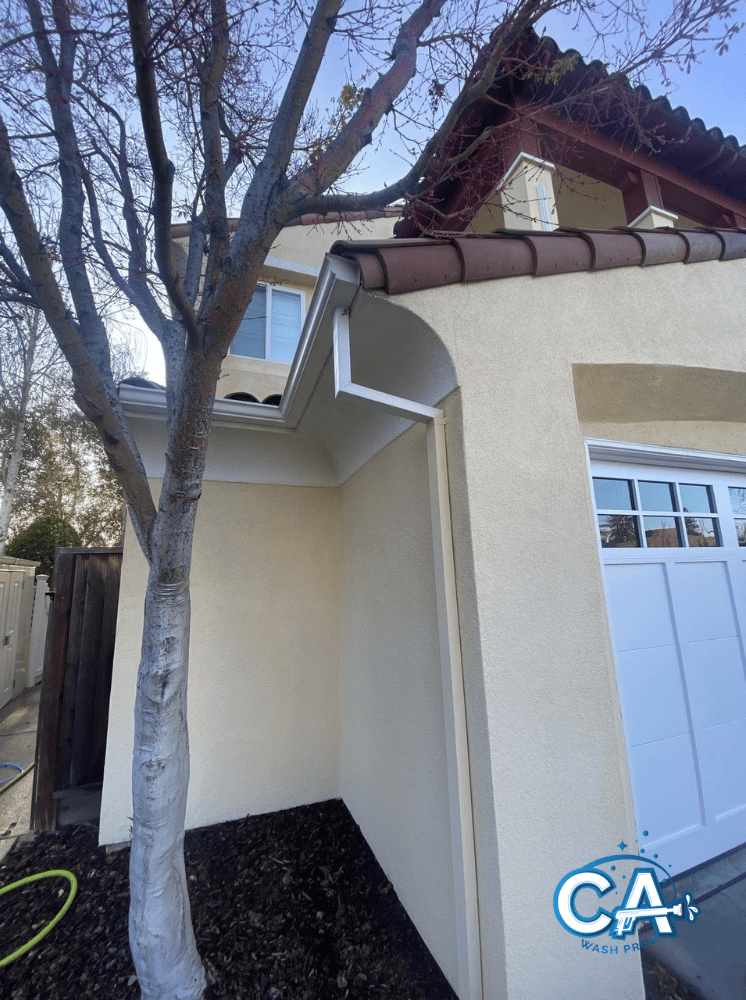 Gutter system cleaned to prevent water overflow in Alameda.