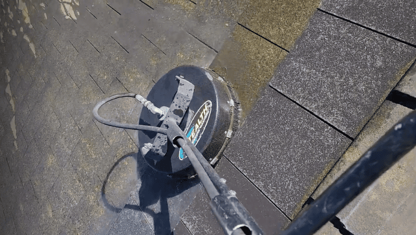 A roof in Dublin being cleaned to remove moss and algae buildup.